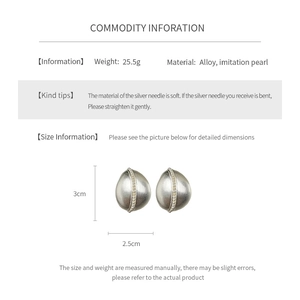 Detail view of oval pearl earrings showing 3cm size and alloy material specifications