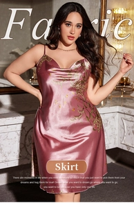 Detailed texture of pink silk satin sleepwear with elegant gold floral prints and straps