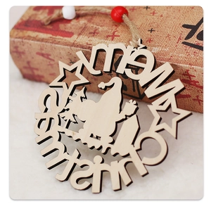 Close-up of a wooden Merry Christmas ornament with Santa Claus silhouette and red beads