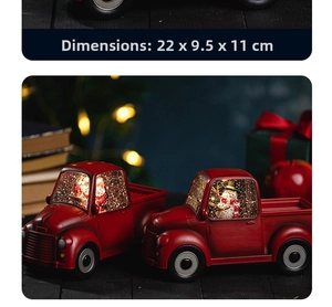 Macro detail of red vintage truck music box with illuminated snow globe and size dimensions