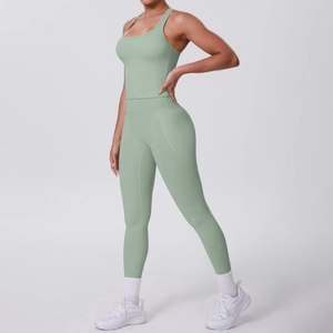 Detail view of sage green yoga set showing side pocket on high-waist leggings