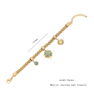 Detail of golden stainless steel beaded chain necklace with turquoise flower charms
