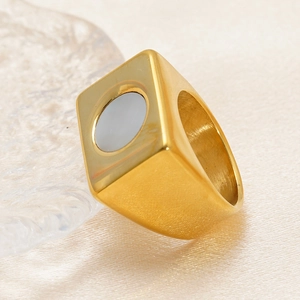 Macro shot of 18k gold plated stainless steel wide ring with white shell inlay