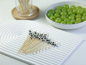 Detailed view of bamboo fruit picks featuring black and white football decorations