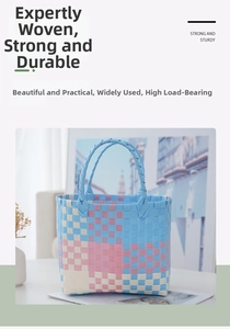 Detail of blue and pink woven picnic bag showing checkered texture and sturdy handles