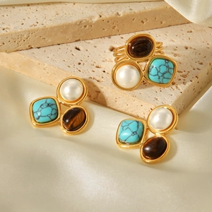 Vintage gold stainless steel jewelry set featuring pearl, turquoise, and tiger eye stones