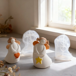 Detail of angel resin silicone molds showing heart and star finished plaster crafts