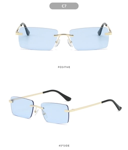 Detail view of rimless square sunglasses in C7 light blue lens and gold metal frame