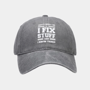 Detail of grey cotton baseball cap with white printed slogan and wrench graphic