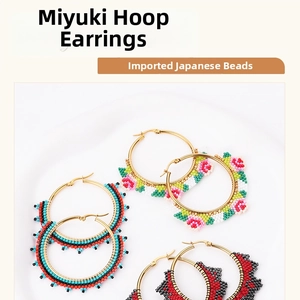 Close-up of handmade Miyuki seed bead hoop earrings with colorful floral weave