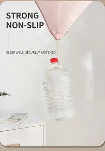 Pink flower quilt clip holding a heavy water bottle to demonstrate strong load-bearing power