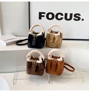 Mini plush bucket bags in four colors with faux fur trim and adjustable crossbody straps