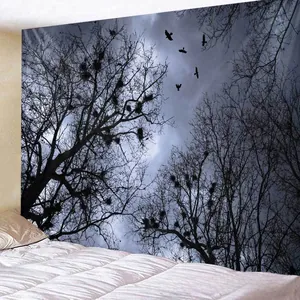 Close-up of gothic wall tapestry showing dark bare trees and birds over a bed
