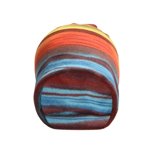 Close-up of the textured multicolor striped knit fabric and tight stitching on the beanie
