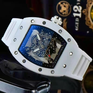 Detailed close-up of a hollow-out luxury watch with white strap and diamond-set case