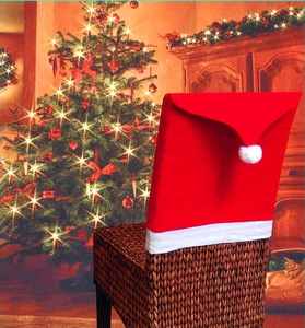 Christmas chair cover in red Santa hat design for holiday dining room decoration