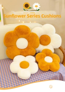Detail of plush flower cushions in orange and white showing soft faux rabbit fur texture