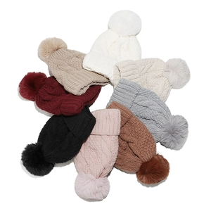 Thick cable knit winter beanie with faux fur pom pom in multiple solid colors for women