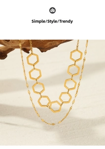 Close-up of double-layer gold plated necklace with hexagonal geometric hollow pendants