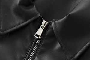 Detailed close-up of metallic zipper and premium black faux leather texture on pilot jacket