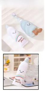 Close-up of soft toothpaste plush doll with embroidered details and tooth paste text
