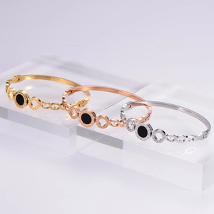 Three-tone titanium steel bangles in gold rose gold and silver with Roman numerals