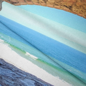 Detailed close-up showing high-density microfiber fabric with vibrant seaside ocean printing