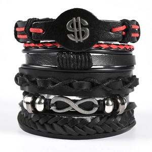Detail view of multi-layer leather bracelets with dollar sign and infinity metal charms