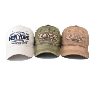 Three vintage washed cotton baseball caps with New York embroidery in white, green and brown