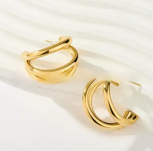 Detailed view of layered gold geometric hoop earrings with polished metallic finish