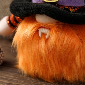 Glow-in-the-dark Halloween gnome plush decoration with orange beard and purple-accented hat