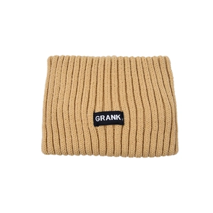 Detailed view of camel ribbed knit headband featuring a stitched black letter label
