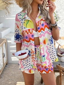 Detail of bohemian two-piece set featuring colorful abstract prints in outdoor holiday scene