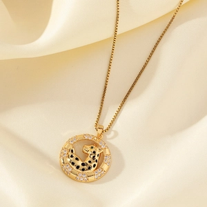 Gold plated leopard pendant necklace with cubic zirconia and green eyes on box chain