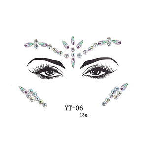 Macro detail of iridescent facial rhinestone stickers for brows and eyes party makeup