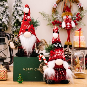 Christmas gnome couple set with red plaid knit hats and pine accents for festive home decor