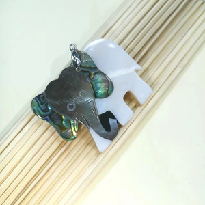 Handmade elephant shell pendant with white and abalone shell inlays on bamboo sticks