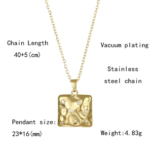 Macro detail of a gold stainless steel star pendant showing size and material specifications
