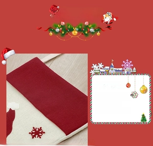Detail of red knit Christmas stocking with white snowflake patch and festive texture
