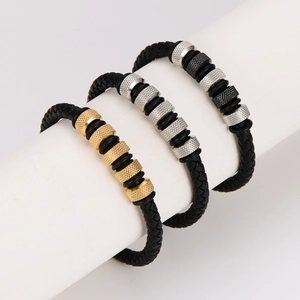 Three men's woven leather bracelets with gold, silver, and black metal clasps on a white stand