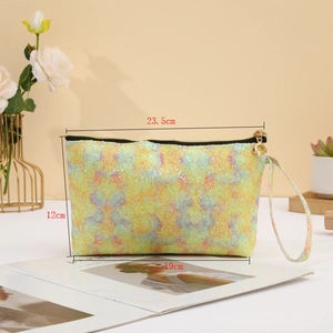 Detailed dimensions of the sequin lace makeup bag in holographic yellow with wrist strap