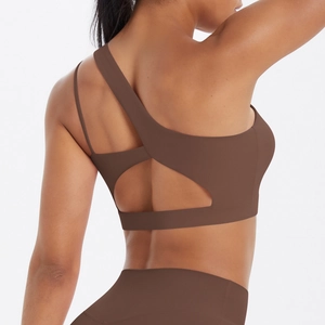 Detail of coffee brown one-shoulder sports bra with asymmetrical cutout back design