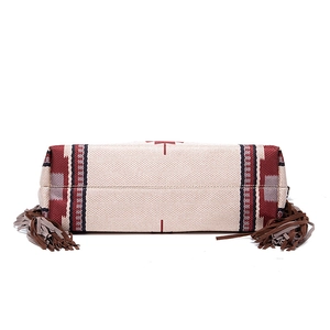 Bottom view of Bohemian canvas shoulder bag with long leather tassels and ethnic stripes