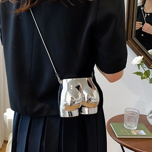 Modern metallic silver hip-shaped crossbody mini bag with slim chain strap