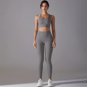 Grey seamless yoga set with racerback sports bra and high-waist leggings for fitness