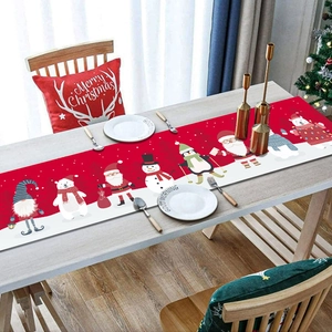 Close-up of Christmas table runner with festive Santa and snowman cartoon characters