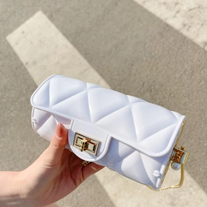 Chic white quilted cylinder jelly bag with gold chain and large pearl accent