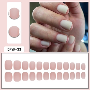 Detail of short square matte nude pink press-on nails set with seamless finish