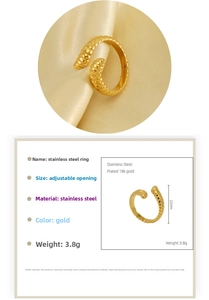 Detail of 18K gold plated stainless steel ring with spiral texture and 22mm height