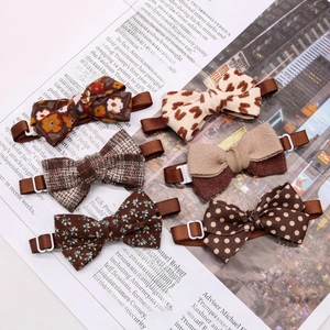 Detail of assorted autumn pet bow ties with adjustable straps and vintage patterns